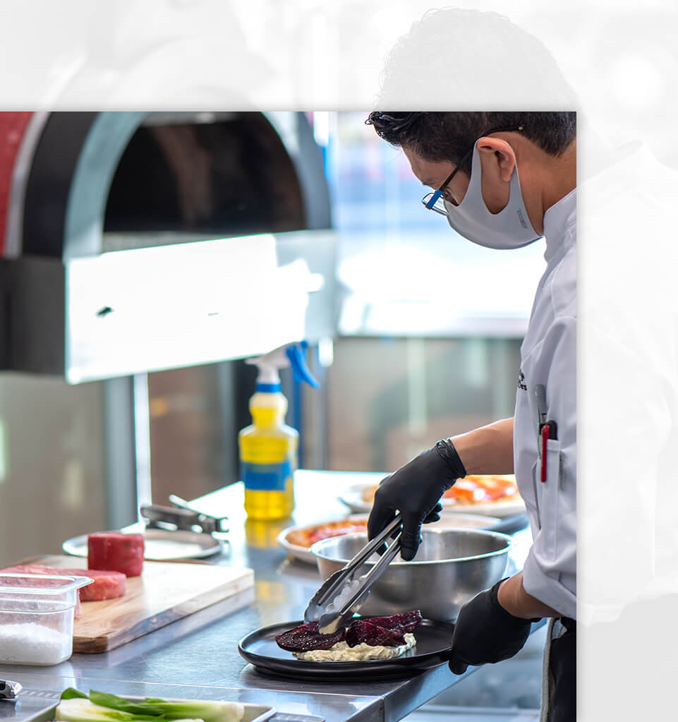 chef preparing and decorating a plate