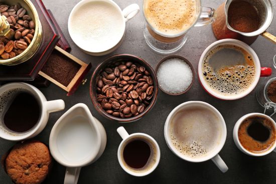 Group of coffee cups with liquid and coffee grains