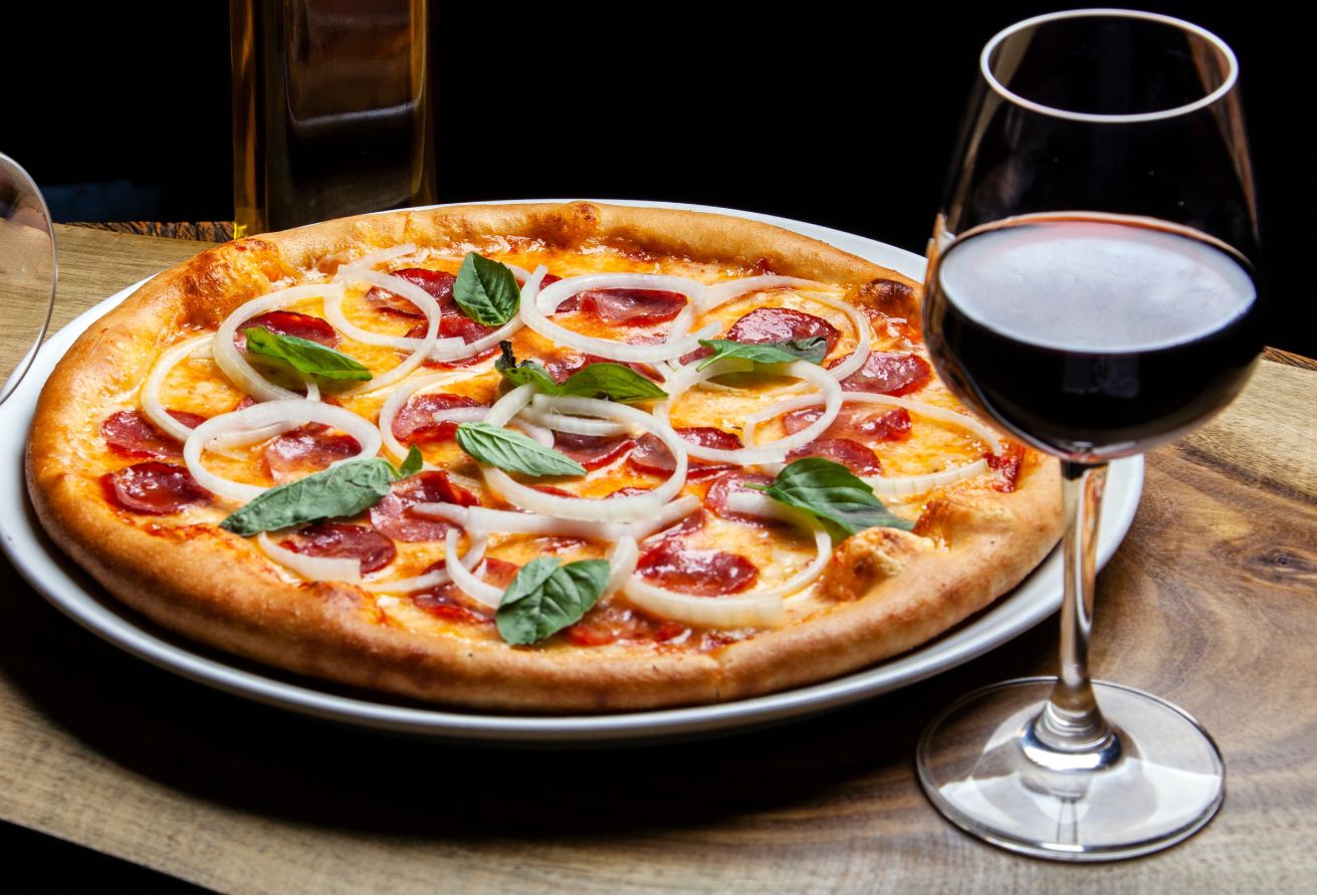 Red wine with shop pizza